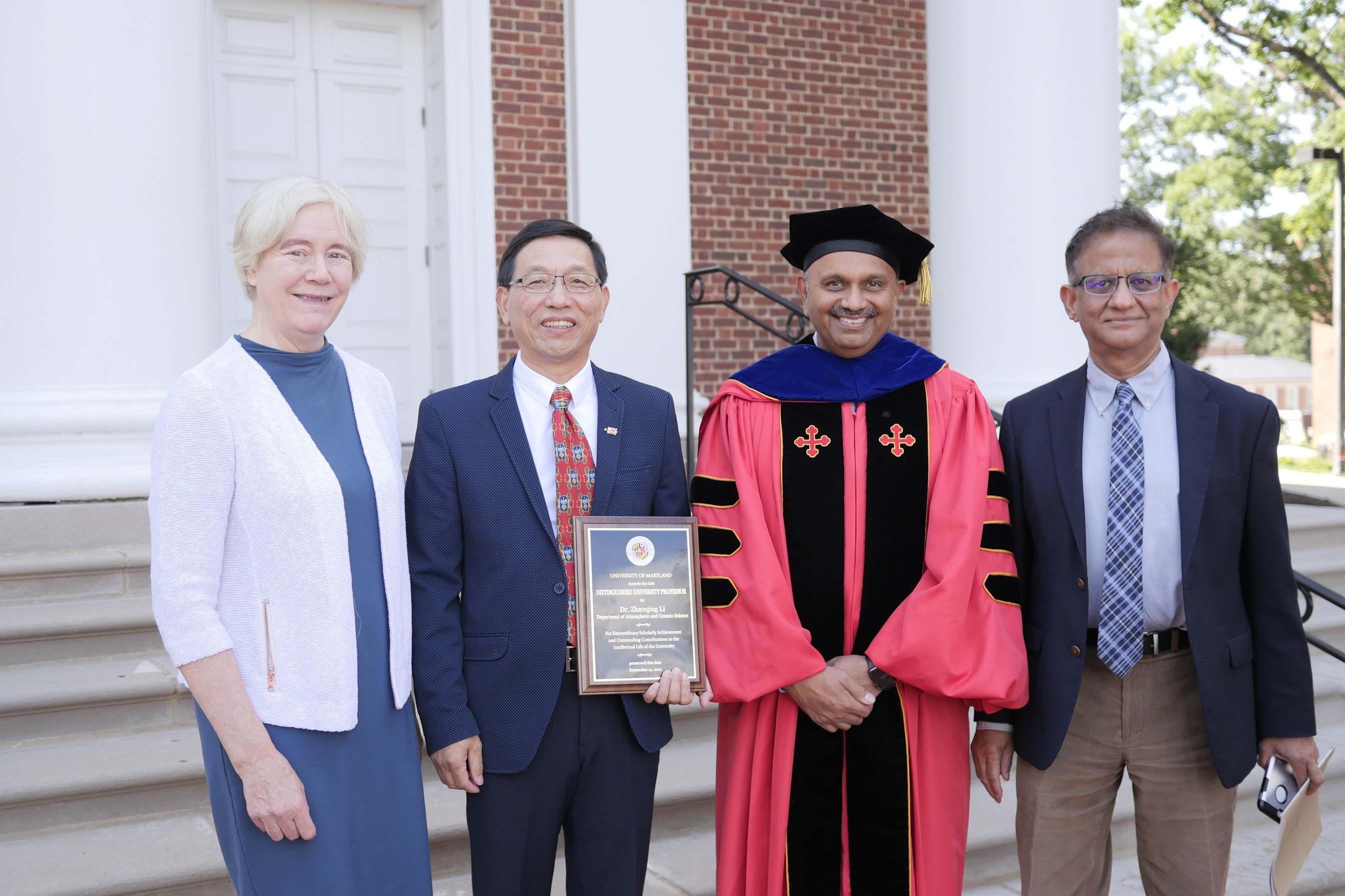 Zhanqing Posing with others in front of memorial chapel