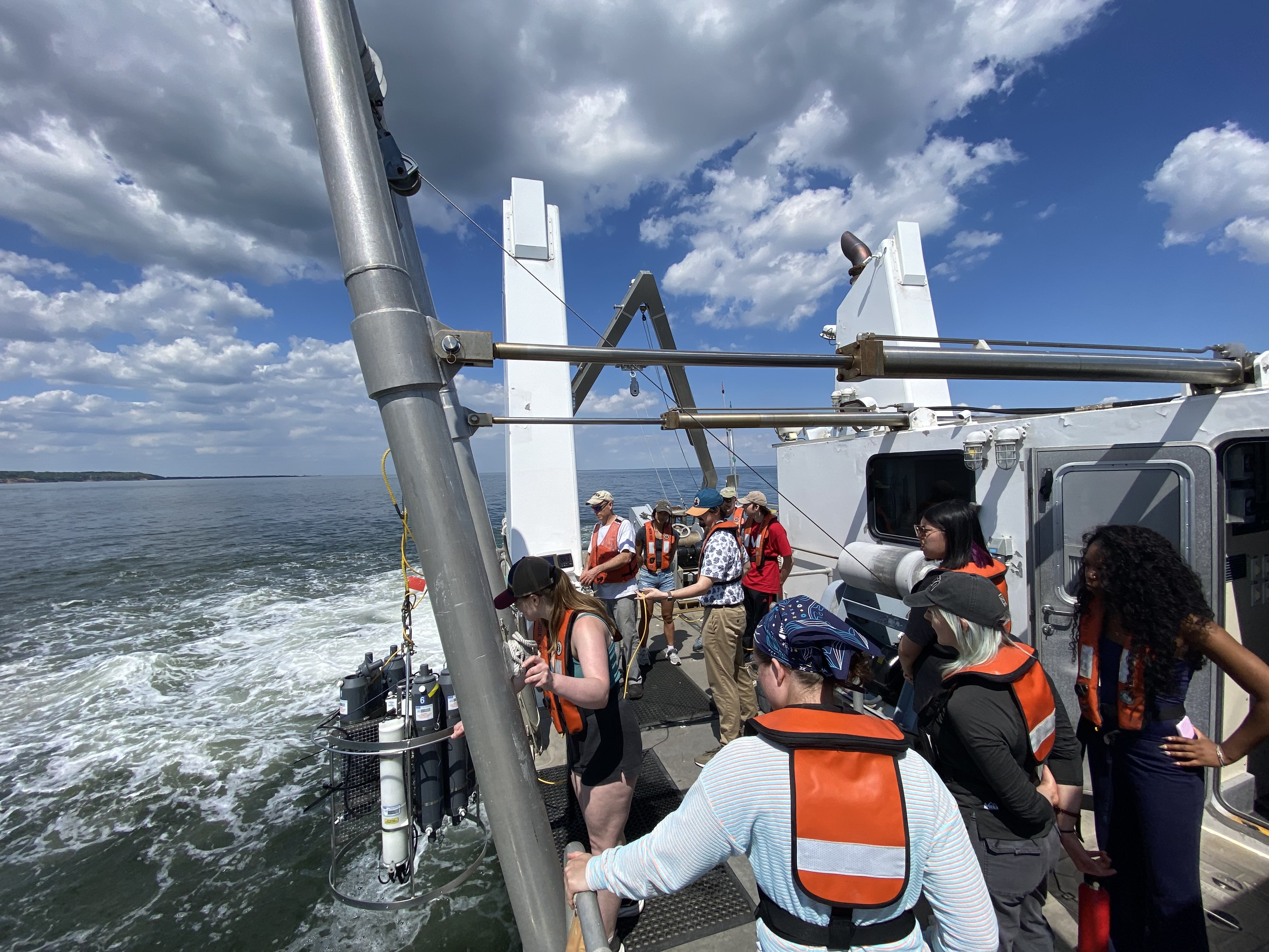 Students on the deck of the ship looking out at the water