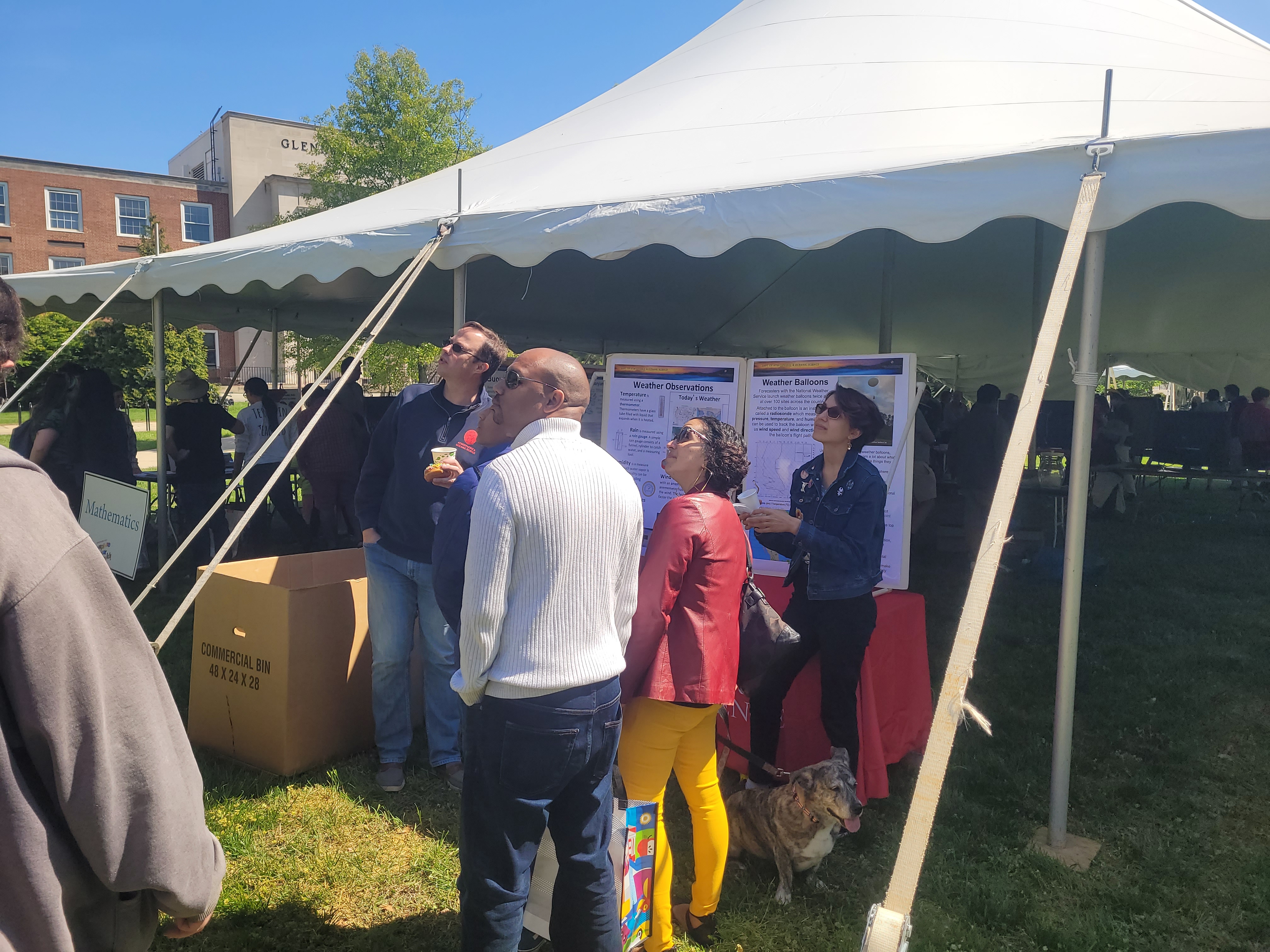 AOSC's Maryland Day tent with visitors standing around