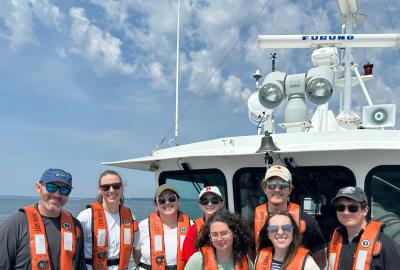 AOSC students and faculty on bow of research vessel