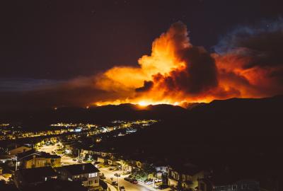 California wildfire burns near a residential area at night 