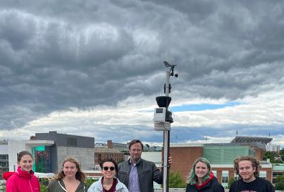 students on the roof of a building with sensor equipment