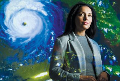Maria Molina with image of Hurricane in background