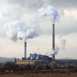 Smoke billows from a power plant